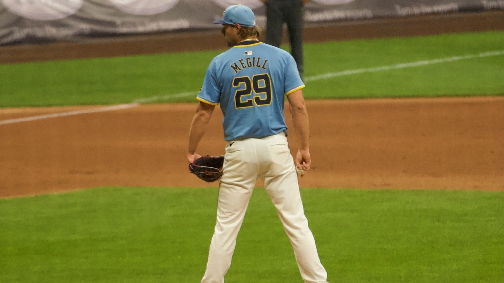 Brewers closer Trevor Megill, No. 29, stands on the mound in a light-blue Brewers jersey during a June 2025 home game in Milwaukee.